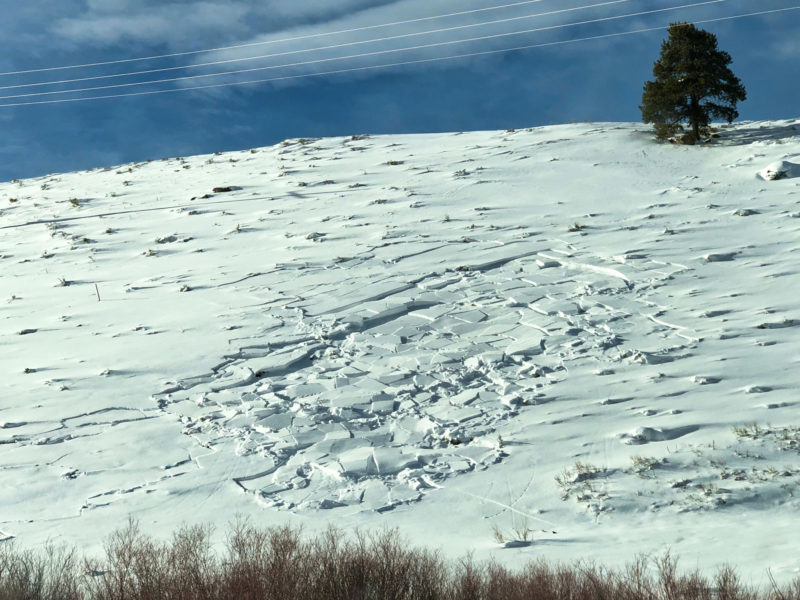 A small natural avalanche just above the highway south of Stanley.