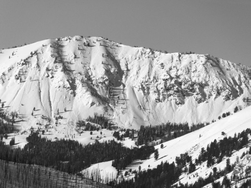 A series of persistent slab avalanches near Baker Creek. Crown lines can be found above, below and to the sides of the main cliff band. 