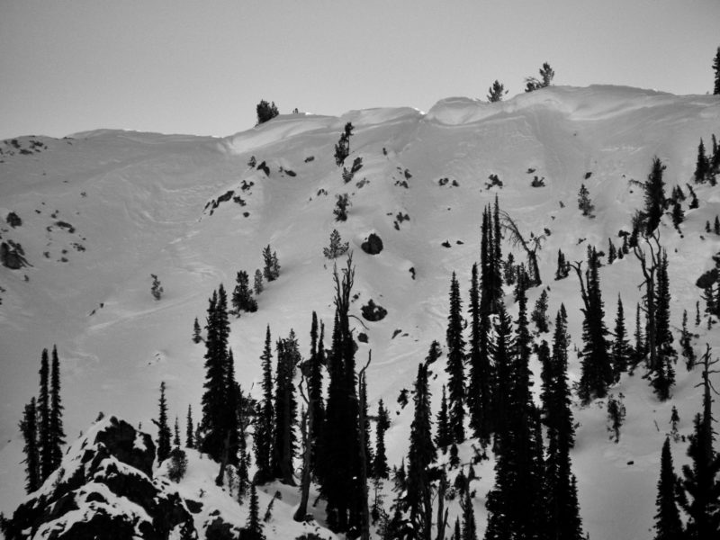 This photo shows a thin avalanche crown on the northeast side of Copper Mountain in the Banner Summit Zone. It appears to be a wind slab that was created during the spike in wind speeds at the end at the beginning of December. It is unclear if it failed naturally or was triggered by the skier's who left the tracks visible in the photo.