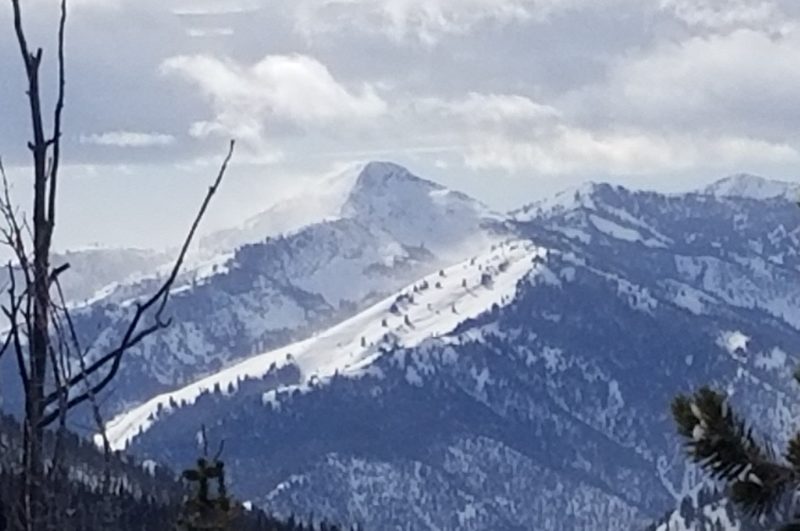 Low resolution photo showing winds pluming snow on multiple ridgelines in the western Smoky Mtns around 2 PM Saturday afternoon. 