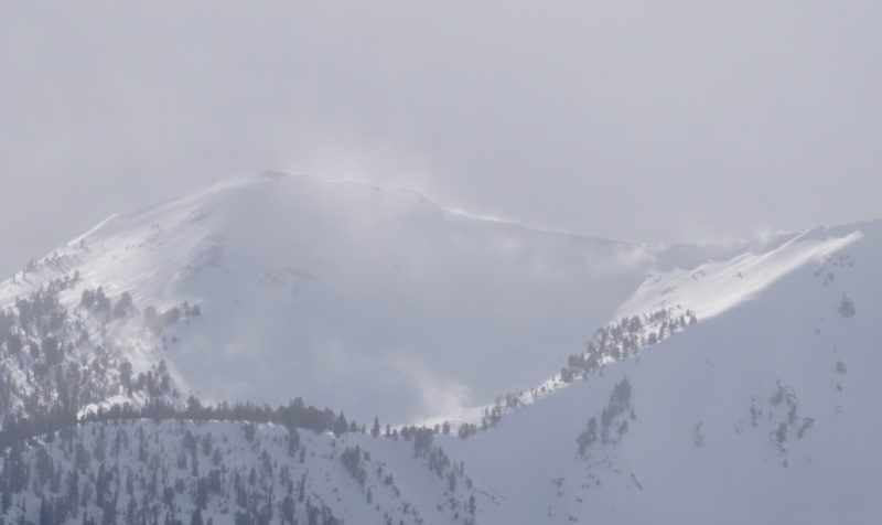 Active wind transport on McDonald Peak in the southern Sawtooth Mtns Tuesday afternoon. Note the shiny crusts on the SE aspect on the left of the photo.
