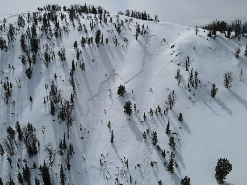 Riders in the Baker Creek drainage triggered this avalanche on Friday, March 18th. It was remotely triggered from the ridgeline in the upper right of the photo, and occurred on a wind loaded, E-NE facing slope at 9500'. It broke over 100' wide and 10-16" thick.