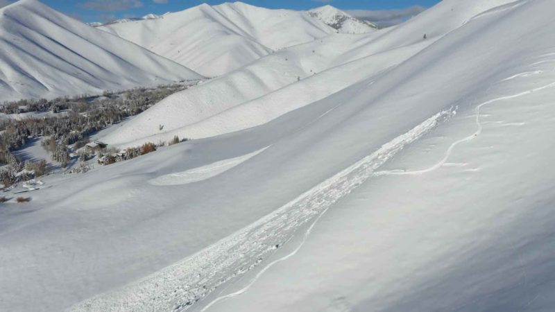 (12/13/2022) Avalanches on NW and W-facing slopes near 6,600' above Fairway Rd in Sun Valley. The avalanche on the right was not caused by the skier. Avalanches in this relatively simple terrain show what to expect this weekend. Photo: S. Cordovano