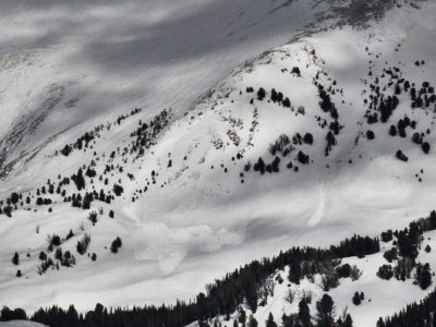 Jan 24, 2023: This recent large avalanche occurred on the shoulder of Duncan Ridge in the Pioneer Mountains. It appears to be a heavily wind-loaded slope that broke on a persistent weak layer. A smaller wind slab avalanche is visible further right in the image. 10,100', WSW.
