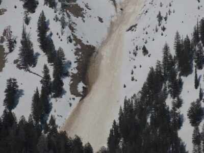 Apr 30, 2023: This large, gouging wet snow avalanche was observed in the Boulder Mountains on a SW-facing slope at 9,700'. It started at a point and quickly gouged through the wet snowpack to the ground, entraining significant amounts of snow, mud, dirt, and rock as it traveled downslope.